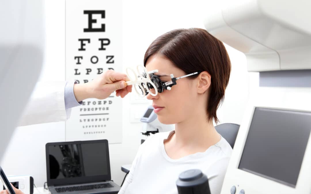 woman doing eyesight measurement with trial frame and visual test chart on white