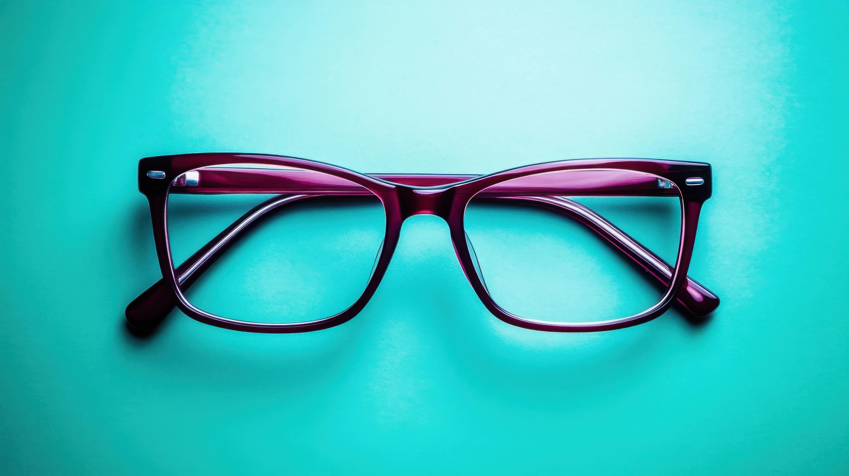 Stylish Purple Frames on Teal Background, Perfect for Fashion and Eye Care Promotions, Showcasing Modern Eyewear Trends and Accessories